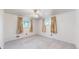 Bright bedroom featuring carpet, a ceiling fan, and two windows with curtains at 14157 E 26Th Ave, Aurora, CO 80011