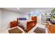 Basement bedroom with hardwood furniture, including a bed, dresser, and nightstand, complemented by two windows at 14157 E 26Th Ave, Aurora, CO 80011