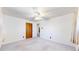 Bedroom featuring carpet, closet with sliding doors, and fan at 14157 E 26Th Ave, Aurora, CO 80011