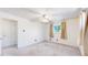 Bedroom featuring carpet, a ceiling fan, and a window with curtains at 14157 E 26Th Ave, Aurora, CO 80011