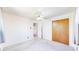 Bedroom featuring carpet, ceiling fan, curtains, and closet at 14157 E 26Th Ave, Aurora, CO 80011