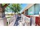 A charming home exterior featuring a brick facade and a well-maintained access ramp leading to the entrance at 14157 E 26Th Ave, Aurora, CO 80011