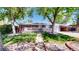 Charming home with a manicured lawn, sidewalk, and a convenient access ramp to the front door at 14157 E 26Th Ave, Aurora, CO 80011