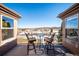 Balcony with outdoor seating and views of the golf course in a residential neighborhood at 16611 Red Cliff Cir, Morrison, CO 80465