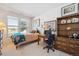 Bright bedroom featuring a cozy bed, large window, and ample space for a comfortable retreat at 16611 Red Cliff Cir, Morrison, CO 80465