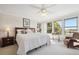 Bright bedroom featuring neutral tones, large windows, and comfortable furnishings for a relaxing retreat at 16611 Red Cliff Cir, Morrison, CO 80465