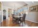Sophisticated dining room with hardwood floors and a well-lit window, perfect for Gathering gatherings at 16611 Red Cliff Cir, Morrison, CO 80465