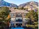 Stunning two-story home with balconies overlooking a scenic mountain backdrop in a beautiful upscale neighborhood at 16611 Red Cliff Cir, Morrison, CO 80465