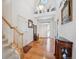 Charming foyer with a staircase, hardwood floors, and a welcoming entrance that leads to different parts of the house at 16611 Red Cliff Cir, Morrison, CO 80465