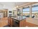 Open kitchen with island, granite counters, stainless appliances, and views at 16611 Red Cliff Cir, Morrison, CO 80465