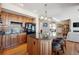 Kitchen with an island, granite countertops, wooden cabinets and stainless appliances at 16611 Red Cliff Cir, Morrison, CO 80465