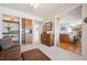 Open-concept living space with built-in bar and kitchen access at 16611 Red Cliff Cir, Morrison, CO 80465