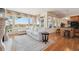 Spacious living room with hardwood floors, fireplace, large windows, and comfortable seating at 16611 Red Cliff Cir, Morrison, CO 80465
