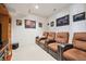 Relaxing in-home theater room complete with comfortable seating and media setup for entertainment at 16611 Red Cliff Cir, Morrison, CO 80465