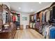 Large walk-in closet with custom shelving and drawers at 16611 Red Cliff Cir, Morrison, CO 80465