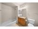 Full bathroom featuring a shower-tub combo and a vanity with storage at 9397 Las Ramblas Ct # D, Parker, CO 80134