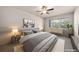 Comfortable bedroom bathed in natural light, showcasing calming decor, and ample space for relaxation at 9397 Las Ramblas Ct # D, Parker, CO 80134