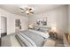 Serene primary bedroom featuring a ceiling fan, neutral tones, and an ensuite bathroom for added convenience at 9397 Las Ramblas Ct # D, Parker, CO 80134