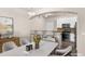 Contemporary dining area adjacent to the kitchen, featuring stylish seating and a breakfast bar at 9397 Las Ramblas Ct # D, Parker, CO 80134