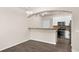 Inviting dining area featuring hardwood floors and an open layout to the kitchen at 9397 Las Ramblas Ct # D, Parker, CO 80134
