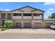 Condo garages with stone accents and gray doors offer convenient parking for residents at 9397 Las Ramblas Ct # D, Parker, CO 80134