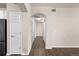 Hallway featuring hardwood floors and access to multiple rooms at 9397 Las Ramblas Ct # D, Parker, CO 80134