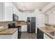 Well-equipped kitchen with modern appliances, granite countertops, and ample cabinet space at 9397 Las Ramblas Ct # D, Parker, CO 80134