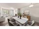 Inviting living room with a fireplace, modern decor, and seamless flow into the dining area with elegant chairs at 9397 Las Ramblas Ct # D, Parker, CO 80134