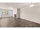 Unfurnished living area with lots of natural light and featuring a fireplace, and hardwood floors at 9397 Las Ramblas Ct # D, Parker, CO 80134