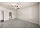 Spacious main bedroom featuring neutral walls and carpet with an ensuite bathroom at 9397 Las Ramblas Ct # D, Parker, CO 80134