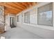 Comfortable outdoor patio featuring a beamed ceiling and exterior windows at 9397 Las Ramblas Ct # D, Parker, CO 80134