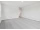 Bright bedroom featuring neutral carpet and crisp white walls and trim at 45910 Gentry Ave, Bennett, CO 80102