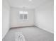 Minimalist bedroom with soft carpet, natural light and neutral decor at 45910 Gentry Ave, Bennett, CO 80102