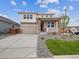 Charming two-story home with stone accents, covered porch, and well-maintained landscaping at 45910 Gentry Ave, Bennett, CO 80102