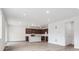Open floor plan featuring a modern kitchen and a spacious living area with hardwood floors at 45910 Gentry Ave, Bennett, CO 80102