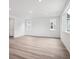 Bright living room with hardwood floors, recessed lighting, and large windows at 45910 Gentry Ave, Bennett, CO 80102