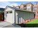 View of a detached one-car garage, featuring a modern design and neutral color that complements the property at 5543 S Prince St, Littleton, CO 80120