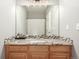 Bathroom vanity with granite countertop and tiled accents at 12035 Leyden St, Brighton, CO 80602