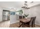 Dining area with kitchen view and wood table at 12035 Leyden St, Brighton, CO 80602