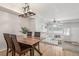 Bright dining area with a wood table and four chairs at 12035 Leyden St, Brighton, CO 80602