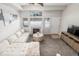 Living room with sectional sofa, fireplace and TV at 12035 Leyden St, Brighton, CO 80602