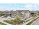 Aerial view of two story home with attached garage and nicely landscaped yard at 9572 Taylor River Cir, Littleton, CO 80125