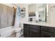 Clean bathroom with a tub shower combo and modern vanity at 9572 Taylor River Cir, Littleton, CO 80125