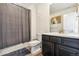 Simple bathroom with a tub shower combo and updated vanity at 9572 Taylor River Cir, Littleton, CO 80125