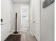 Clean hallway with powder room and tile flooring at 9572 Taylor River Cir, Littleton, CO 80125