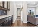 Bright hallway with hardwood floors and coat rack at 9572 Taylor River Cir, Littleton, CO 80125