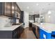 Spacious kitchen with an island and hardwood floors at 9572 Taylor River Cir, Littleton, CO 80125