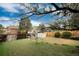 Spacious backyard with wood fence, mature trees, shed, and plenty of room for activities at 3961 S Uravan St, Aurora, CO 80013