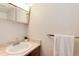 Bright bathroom featuring a sink, towel rack, and medicine cabinet at 3961 S Uravan St, Aurora, CO 80013