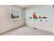Bedroom design showcasing cartoon dogs painted on a accent wall and carpeted floor at 3961 S Uravan St, Aurora, CO 80013